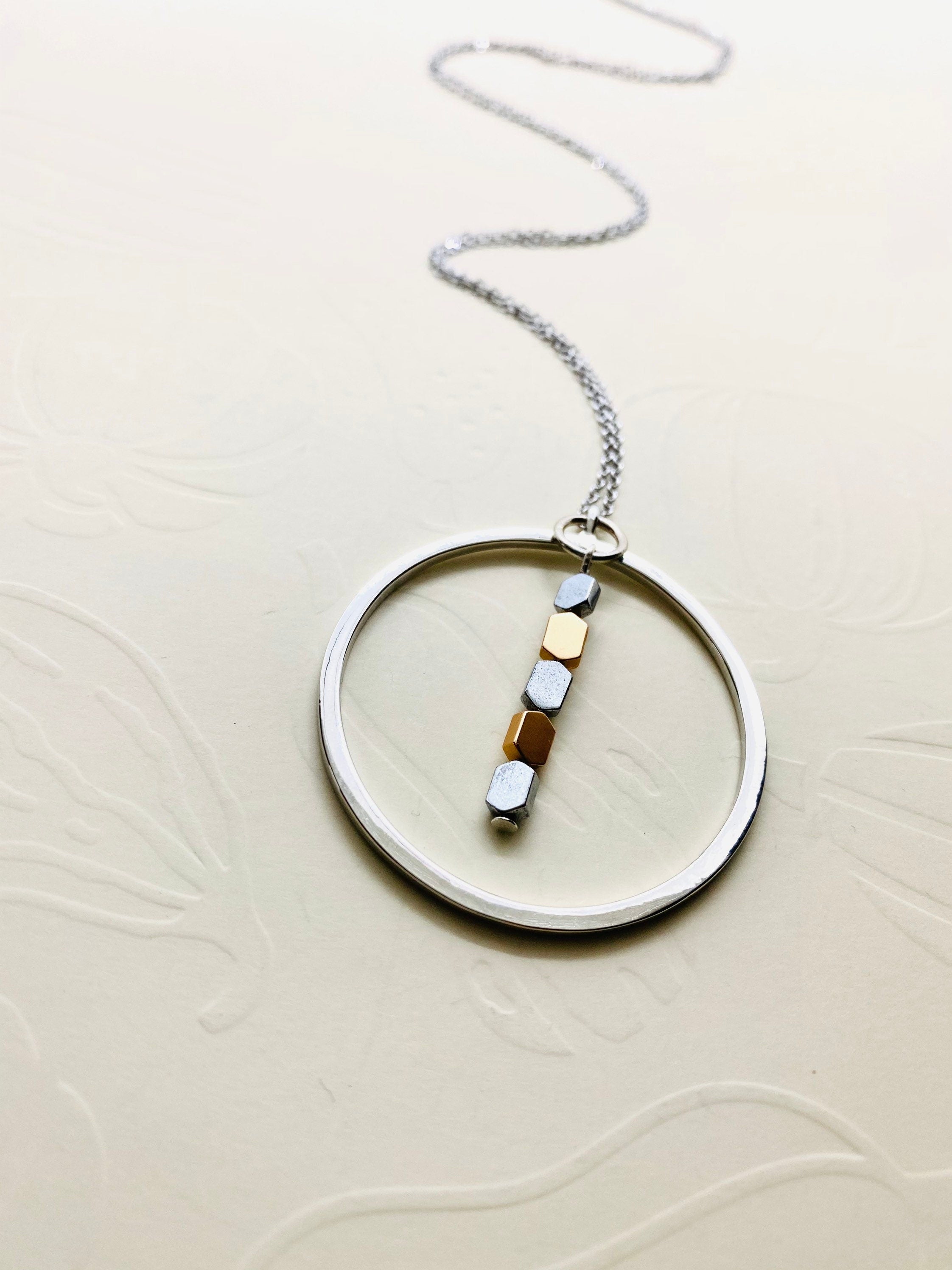 Silver Plated Circular Pendant Necklace with Hematite Beads
