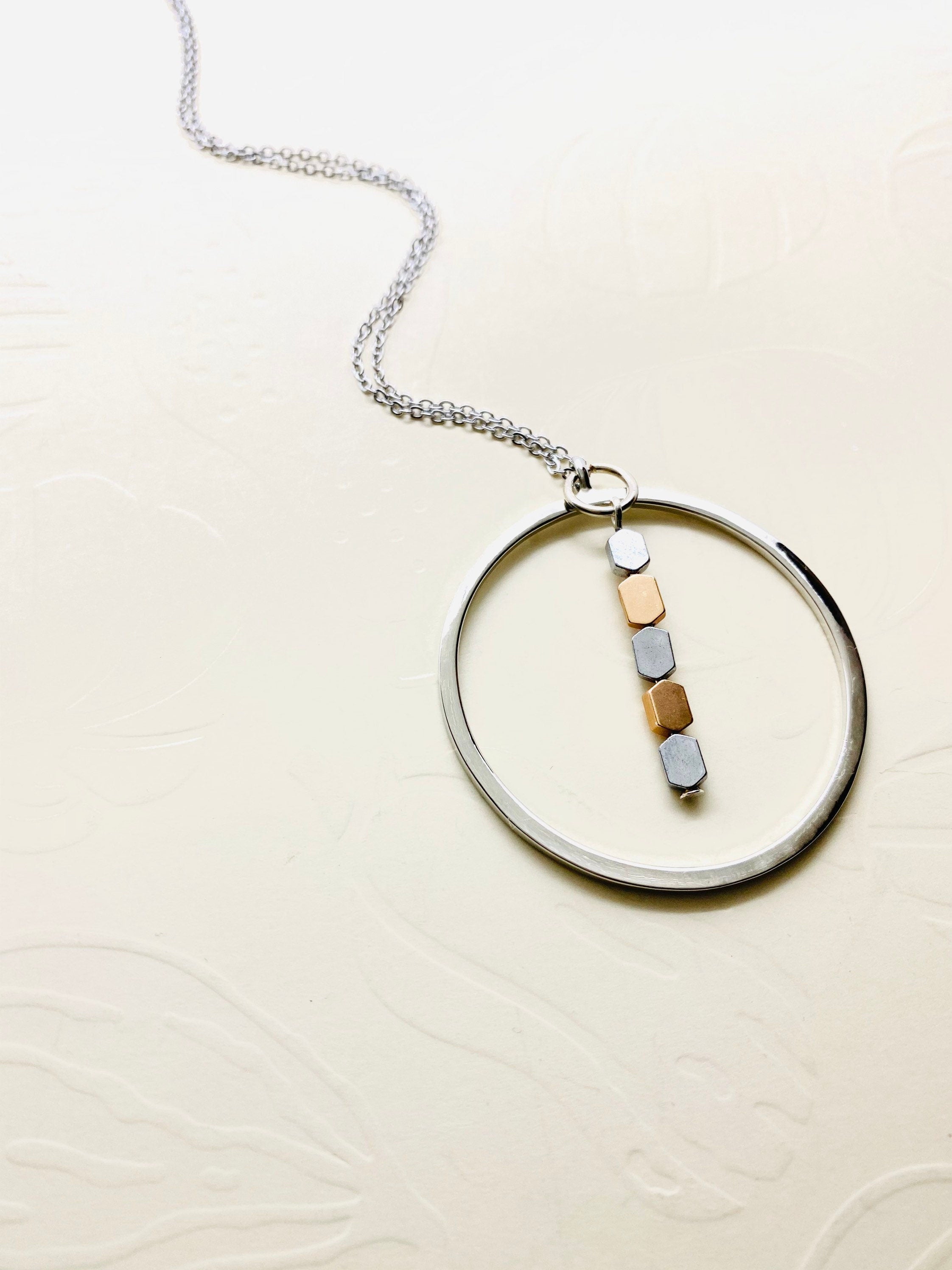 Silver Plated Circular Pendant Necklace with Hematite Beads